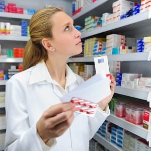 a pharmacist at work behind the counter of a pharmacy, mistake, atenolol shortage, ethical question