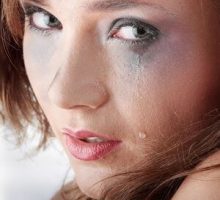 sad and depressed young woman crying