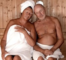 seniors couple relaxing in sauna