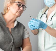 Senior woman looking at shingles vaccination