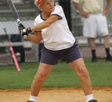Senior woman getting physical activity by playing softball
