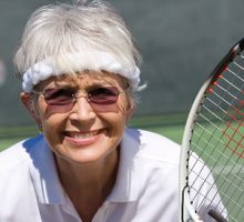 Senior woman playing tennis