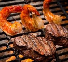 shrimp and steak on a grill