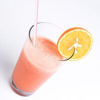 a pink smoothie with a straw