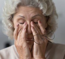senior woman seeks solution for dry nose