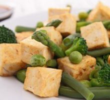 tofu cubes in a vegetable stir fry