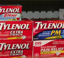 Various Tylenol brands on a pharmacy shelf