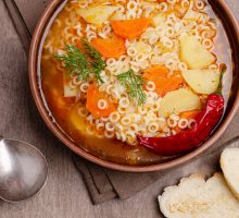 Hot soup with vegetables, pasta and chile pepper