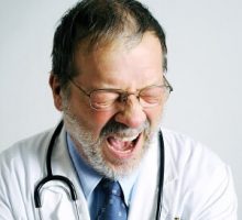 a sleepy doctor yawning