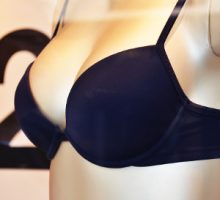 A mannequin modeling a bra in a shop window