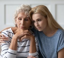 Confused older woman with daughter