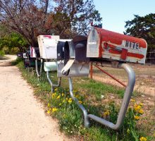 rusty mailboxes on a country road