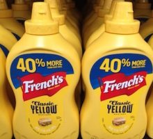 rows of yellow mustard on a store shelf