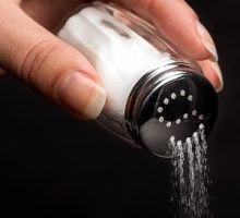 pouring salt from a salt shaker