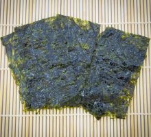 roasted seaweed sheets (nori) on traditional bamboo mat