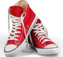 a pair of red canvas sneakers