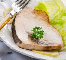 cooked swordfish steak with greens