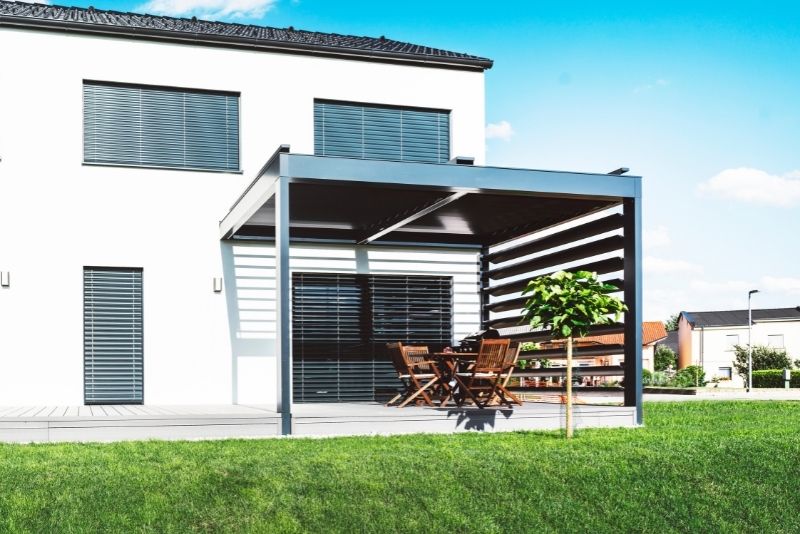 slanted pergola attached to house