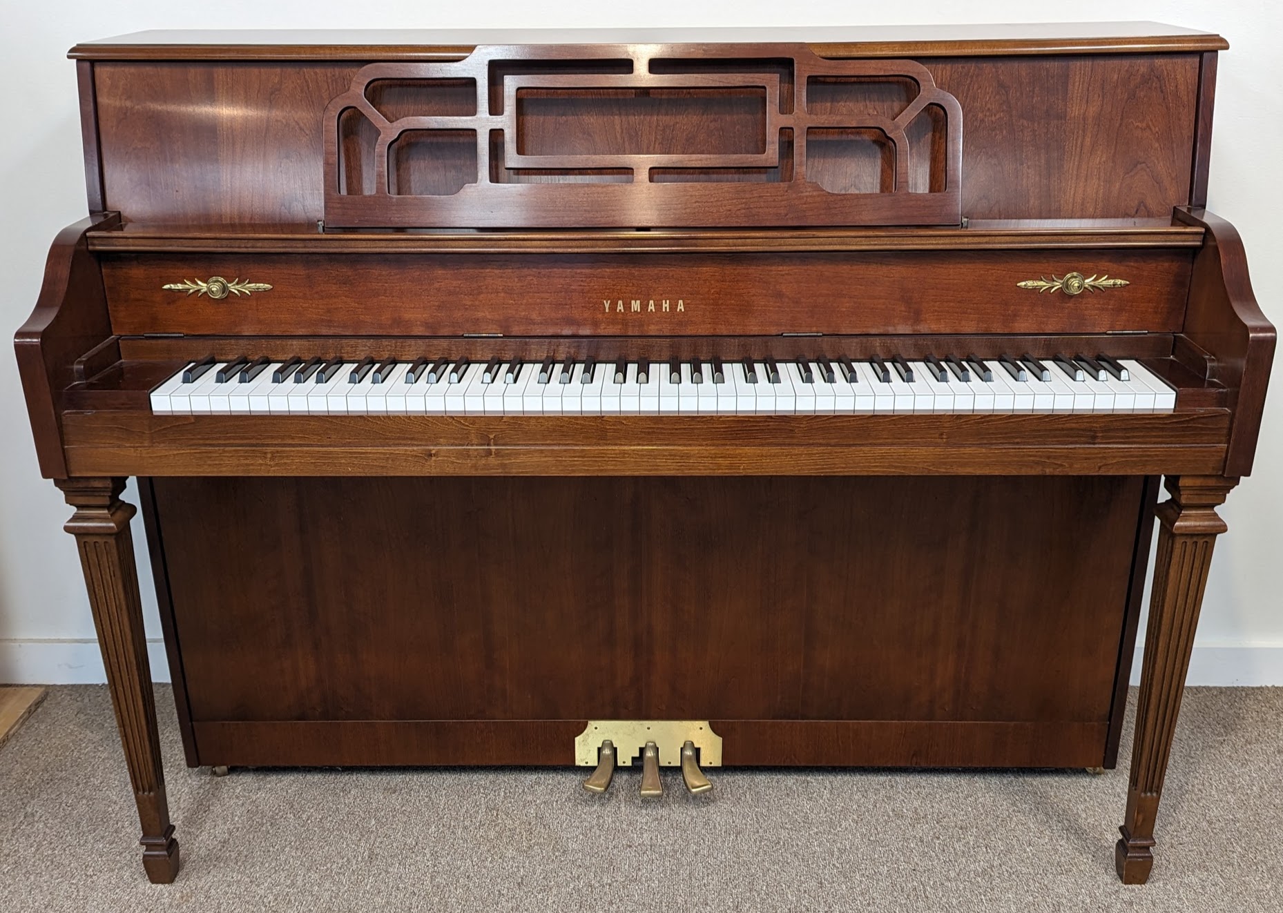 Walnut Yamaha studio upright