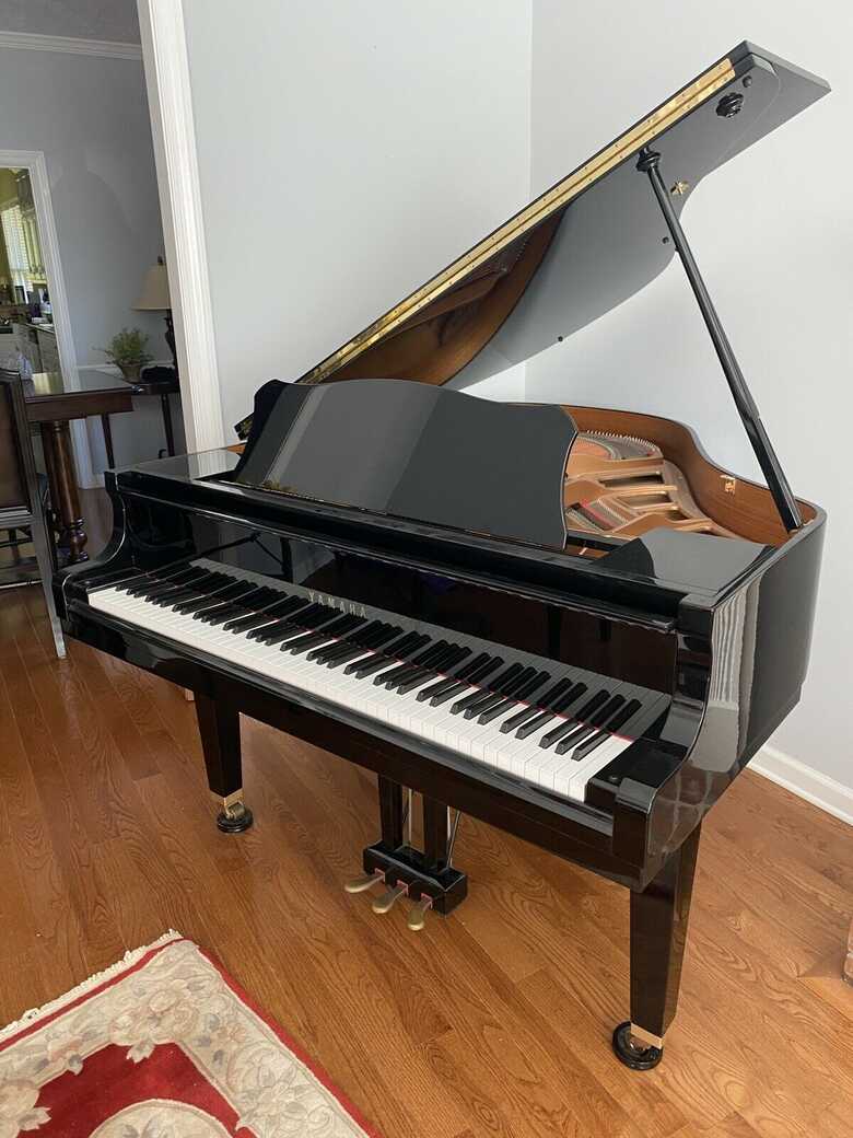 Immaculate Yamaha baby grand piano