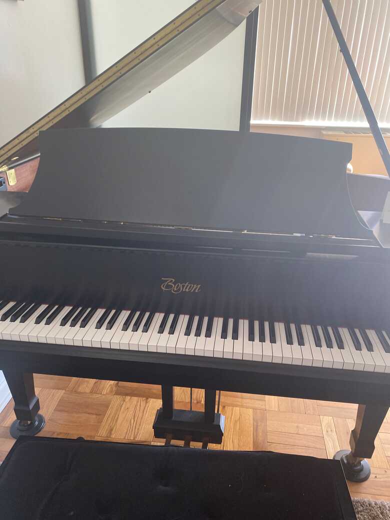 Boston baby grand, well maintain piano owned by pianist 