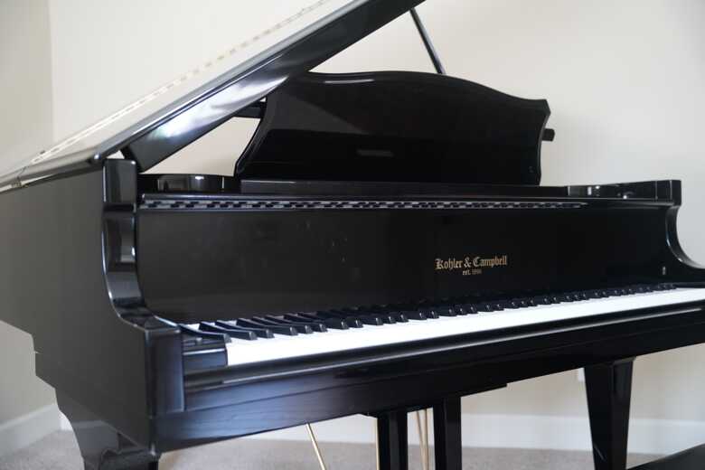 5’10” BLACK GRAND PIANO