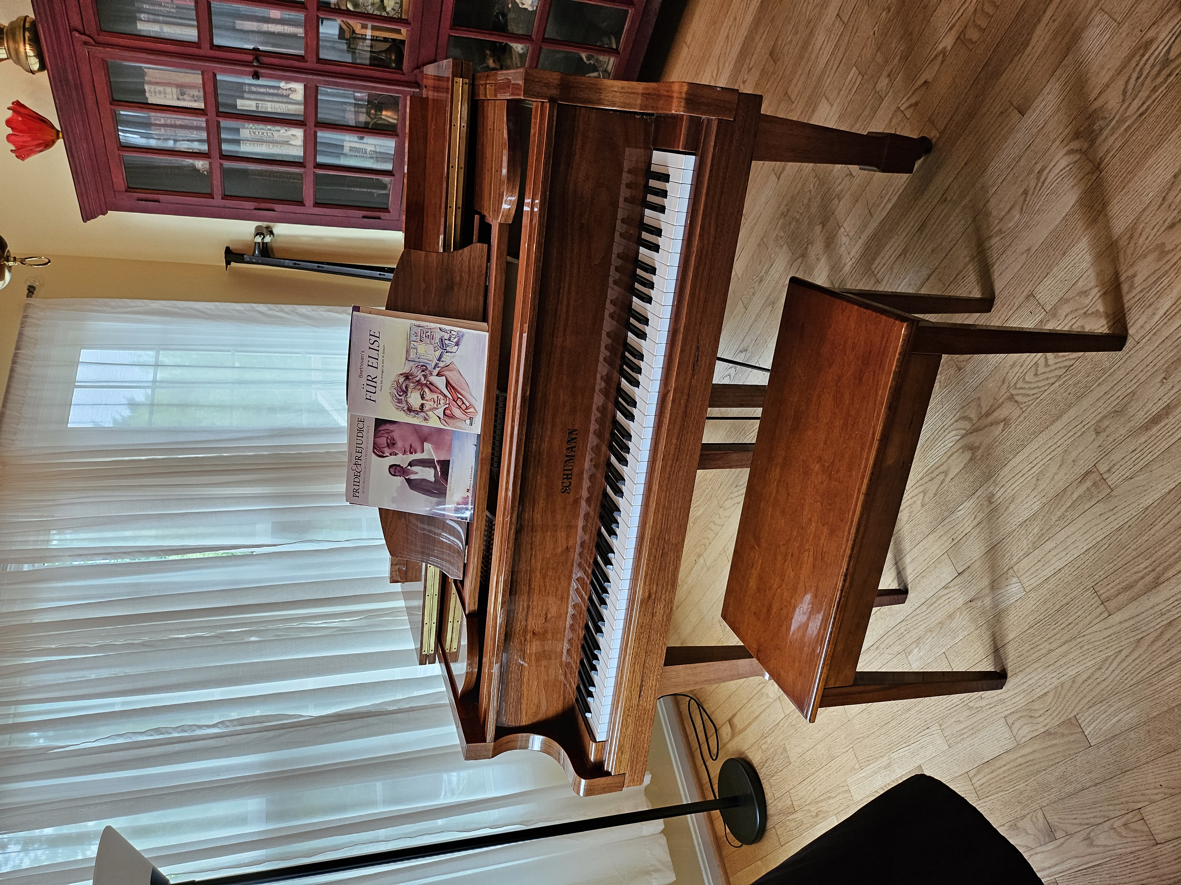 Baby grand piano with matching bench. Must sell asap.