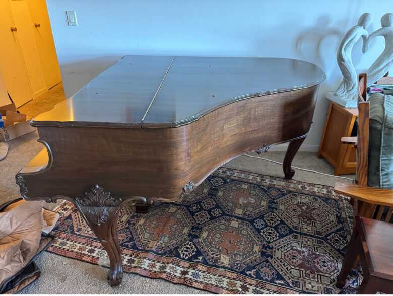 Beautiful carved walnut case, refurbished baby grand