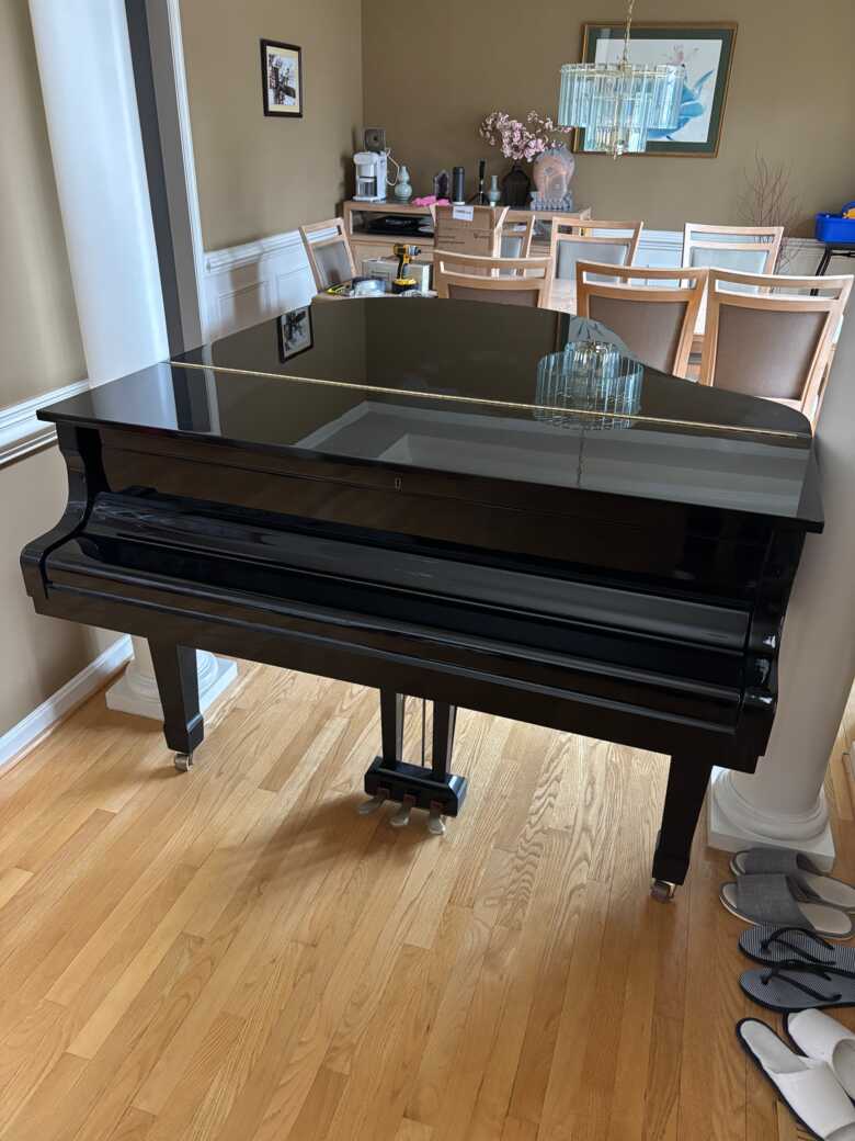 Lightly used Yamaha baby grand piano, black