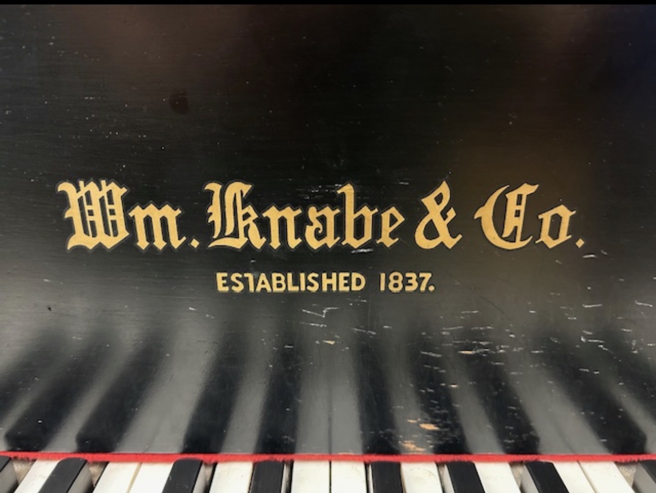 Early WM Kanabe and Co. black lacquer baby grand piano