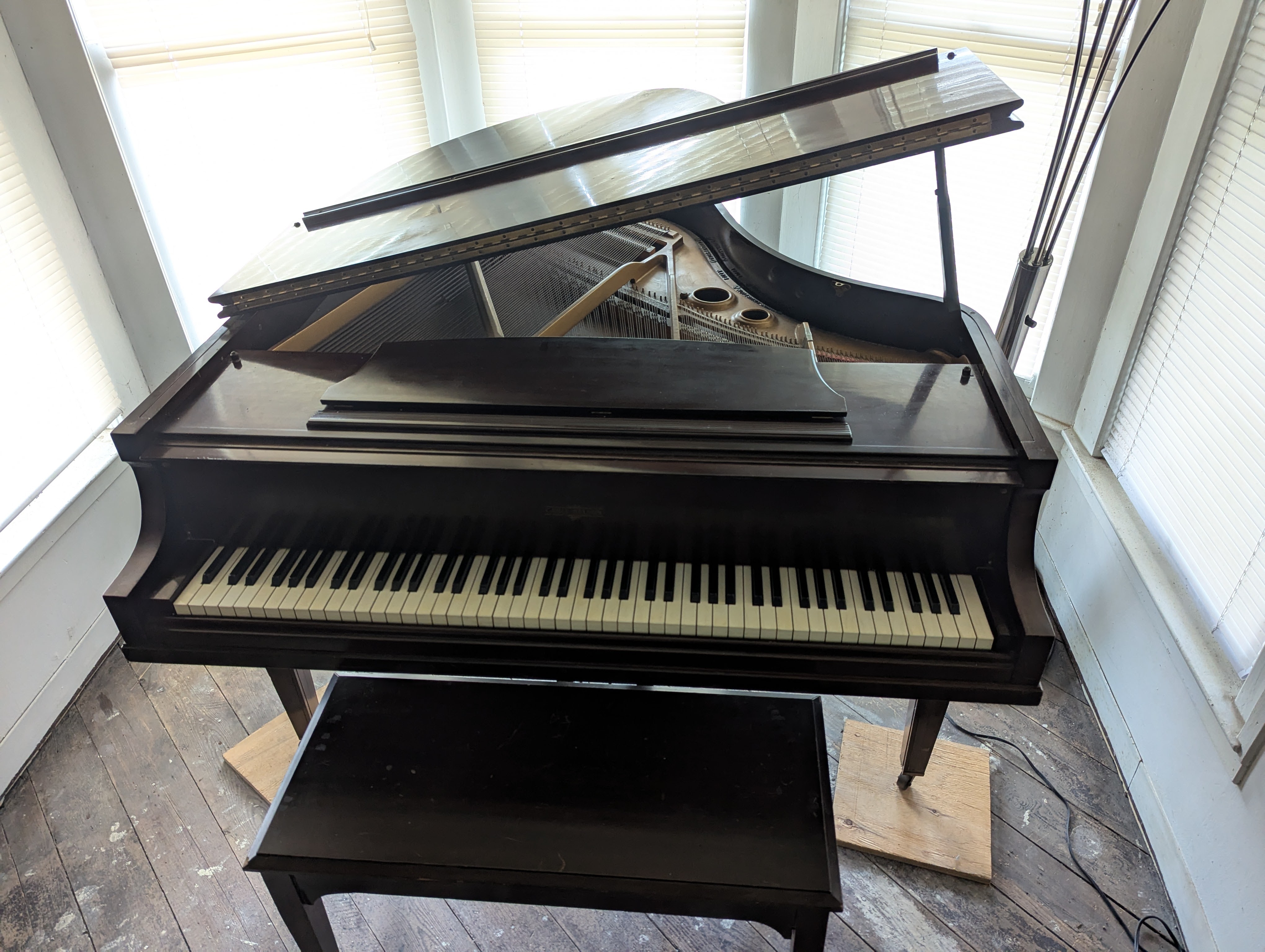Used baby grand piano with bench