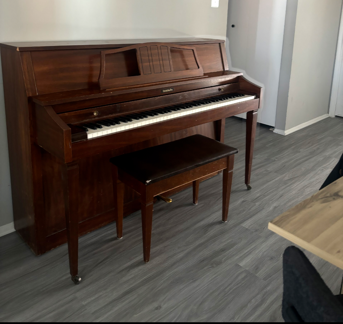 Baldwin upright piano and bench 