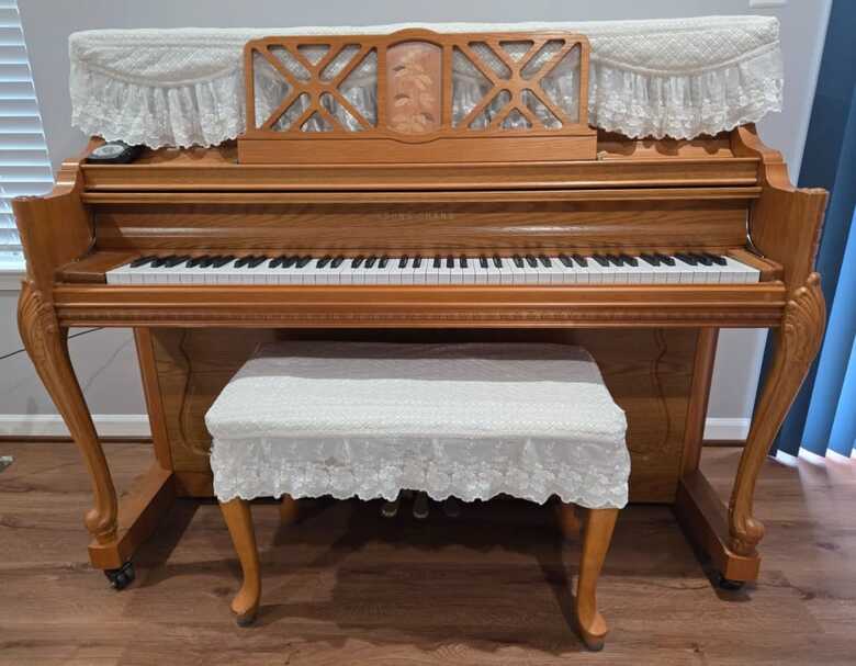 Young Chang piano with padded bench and metronome