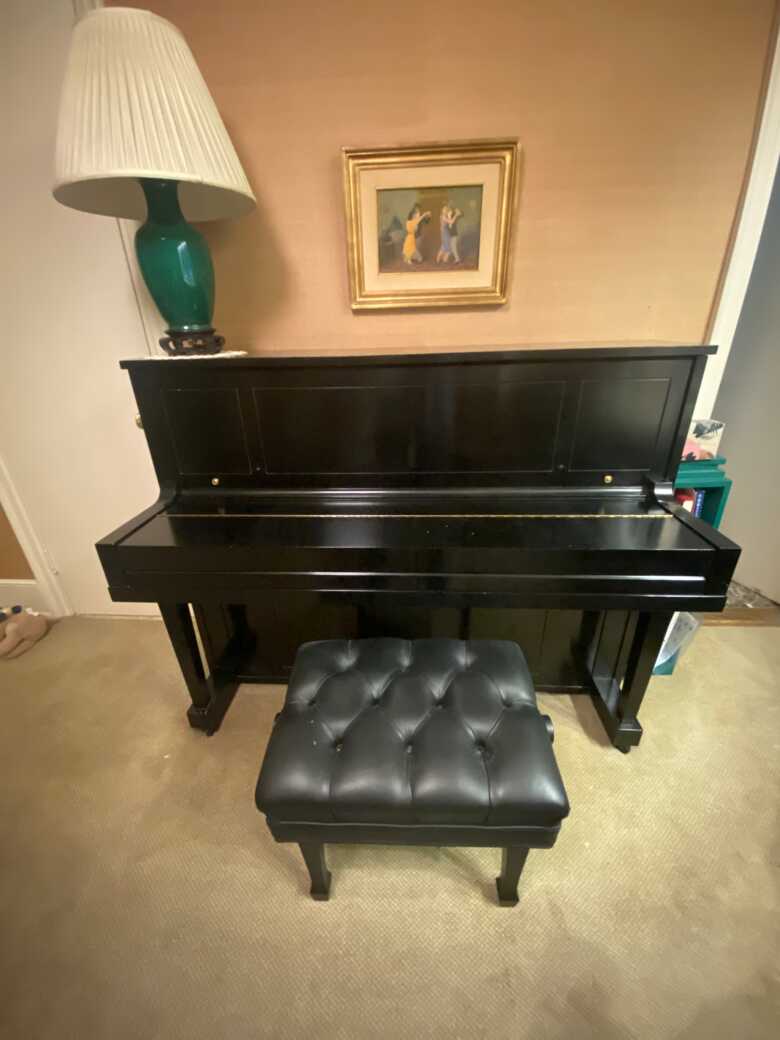 Upright 1989 Steinway lightly used; in good condition