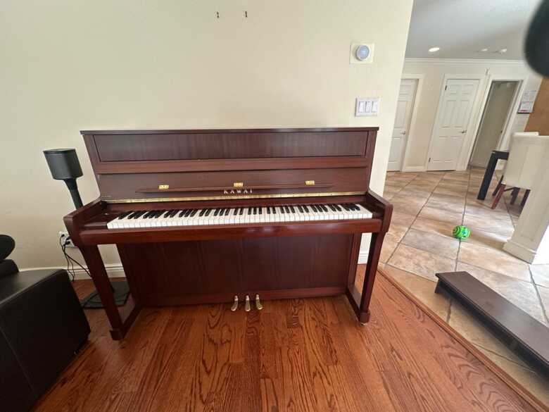 Very good condition mahogany finish Kawai K200.