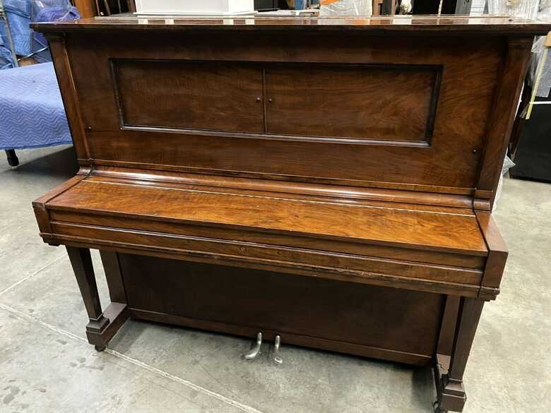 Steinway & Sons professional upright piano.