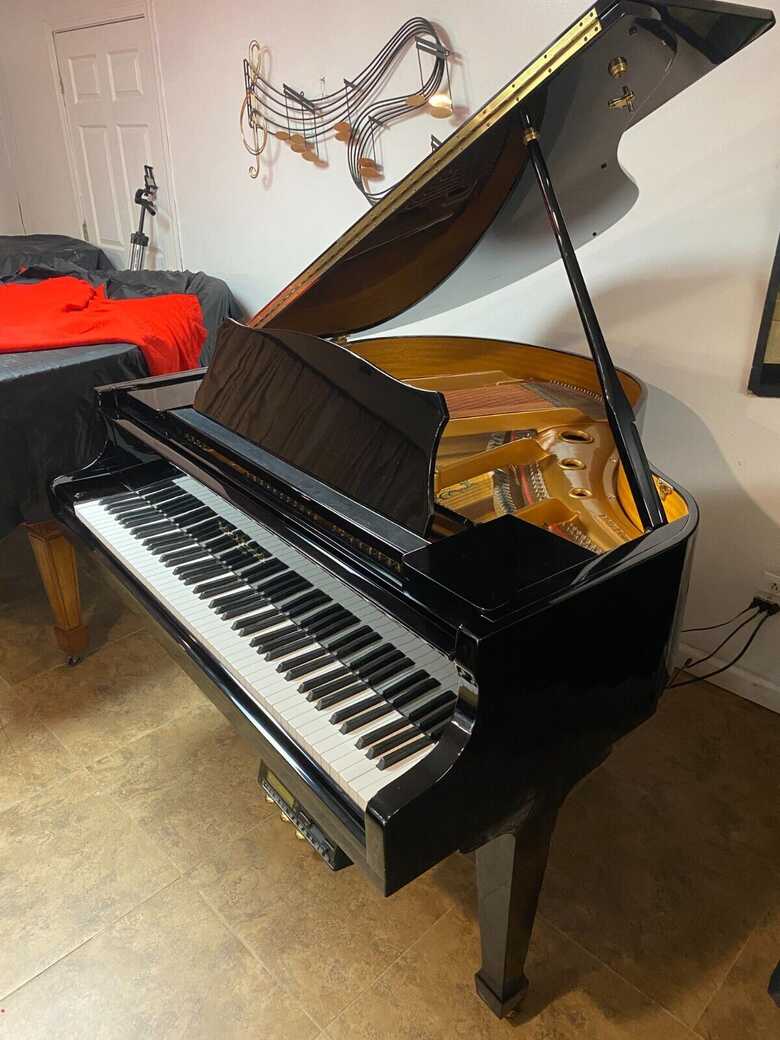Exceptional 4'9 self player baby grand piano