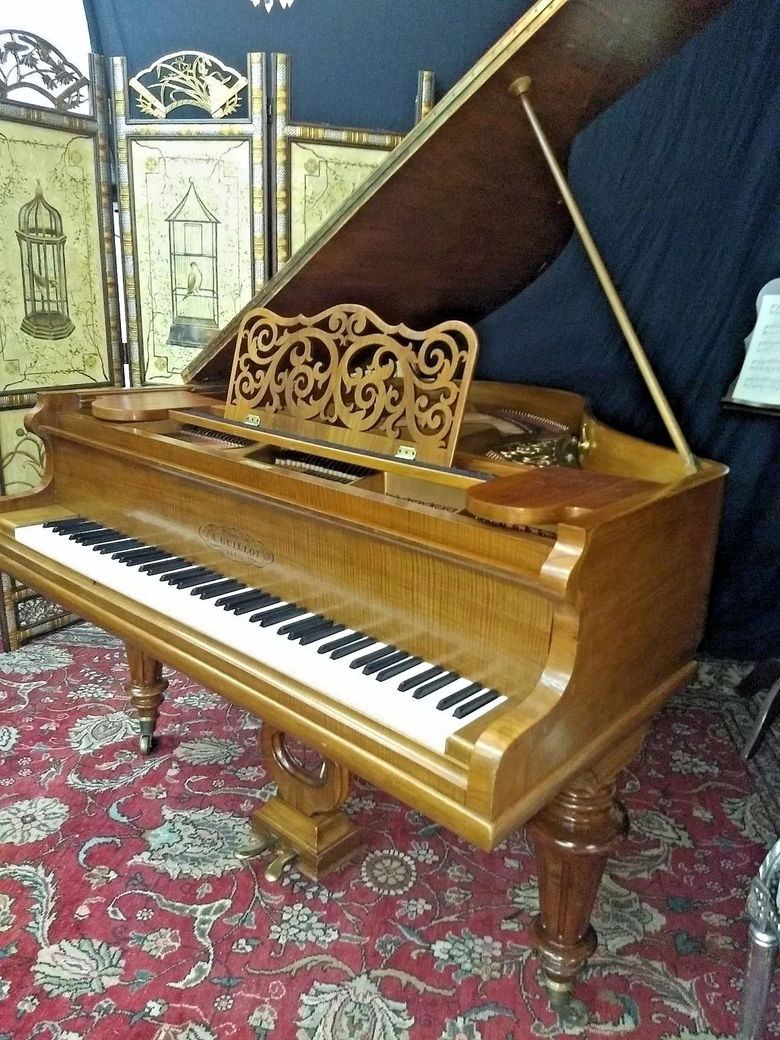 Victorian style baby grand piano