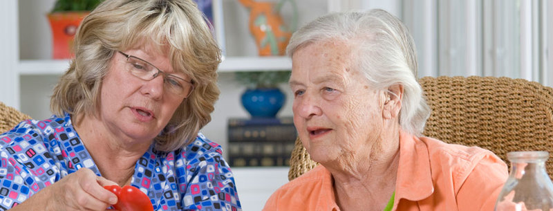 Caregiver helping senior client