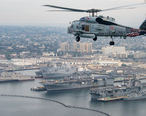 An_MH-60R_Sea_Hawk_helicopter_flies_over_San_Diego.__24546100368___cropped_.jpg