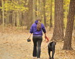 Girl_walking_dog_at_Lake_Johnson.jpg