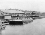 Lumber_Docks_in_Old_Saginaw_City_at_Mackinaw_Street_1888.jpg