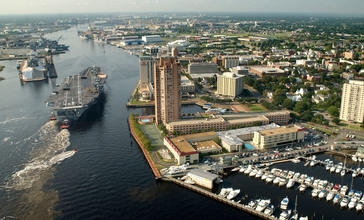US_Navy_030820-N-9851B-011_Tug_boats_guide_USS_Harry_S._Truman__CVN_75__up_the_Elizabeth_River__past_Portsmouth_landmarks.jpg