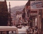 MAIN_STREET_OF_LOGAN__WEST_VIRGINIA__SHOWING_A_NARROW_STREET_WITH_PARKING_ON_ONLY_ONE_SIDE_WHICH_IS_TYPICAL_IN_MANY..._-_NARA_-_556422.jpg