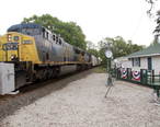 CSX_locomotive_617_passing_by_the_Railside_House_Museum-_Hawthorne__Florida__5757952463_.jpg