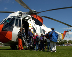 US_Navy_040513-N-6436W-003_Avionics_Technician_2nd_Class_Ryder_Buttrey_shows_a_third_grade_class_from_Graph_Laurel_Elementary_School_the_features_on_a_UH-3H_SAR_helicopter.jpg