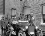 Fifteen_uniformed_policemen_gather_around_a_police_car_adjacent_to_the_Venice_Police_Station__ca.1920.jpg