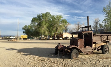 2015-04-29_18_29_47_Old_truck_and_buildings_in_Dyer__Nevada.jpg