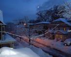 Summit_New_Jersey_street_after_snowfall_in_early_morning_with_houses_and_porches_and_car_and_moon.JPG