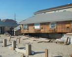B217_beach_houses_shoved_off_piers_Sandy_jeh.jpg